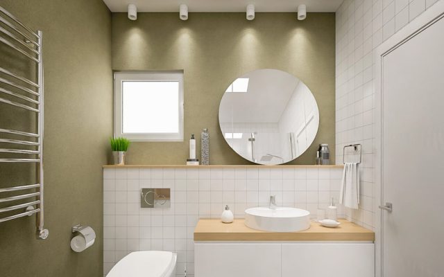 Modernes Badezimmer mit rundem Spiegel und weißen Fliesen